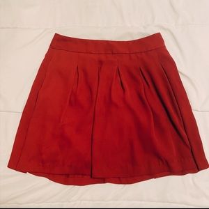 Red pleated skirt with pockets